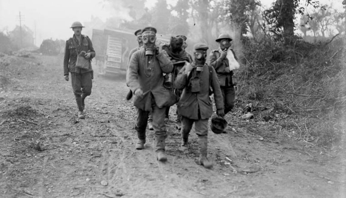 121_Tanks advancing. Prisoners bring in wounded wearing gas masks. Battle of Amiens.